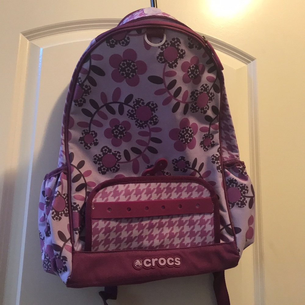 A crocs purple flower book bag